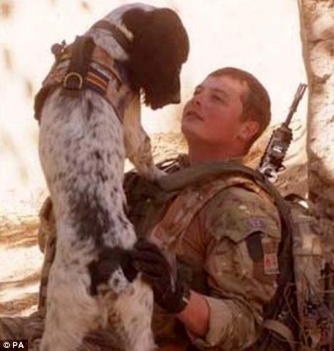 Lance Corporal Liam Tasker with his army dog Theo in the war zone