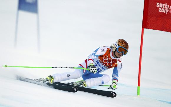 Austria's Fenninger clears a gate during the women's alpine skiing Super G competition at the 2014 Sochi Winter Olympics