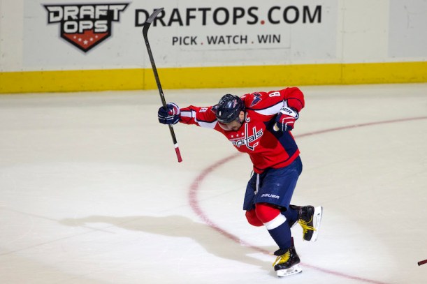 Washington Capitals left wing Alex Ovechkin (8) celebrates just after scoring his 500th career goal during the second period of a NHL hockey game against the Ottawa Senators in Washington, D.C., Sunday, Jan. 10, 2016. (AP Photo/Jacquelyn Martin)