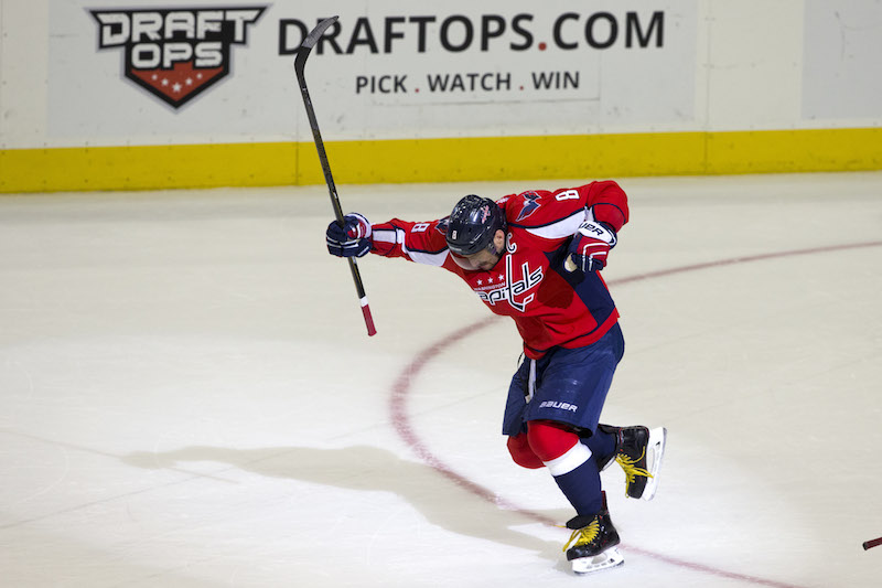 Washington Capitals left wing Alex Ovechkin (8) celebrates just after scoring his 500th career goal during the second period of a NHL hockey game against the Ottawa Senators in Washington, D.C., Sunday, Jan. 10, 2016. (AP Photo/Jacquelyn Martin)